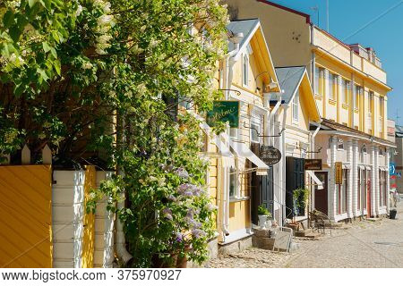Porvoo, Finland - 3 June 2020: Beautiful Street With Shops And Blooming Flowers In Old Town Of Porvo