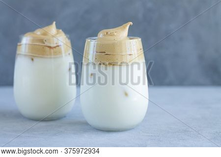Trendy Dalgon Coffee With Tasty Cream Foam, Cold Milk, Ice Cubes. Space For Your Text
