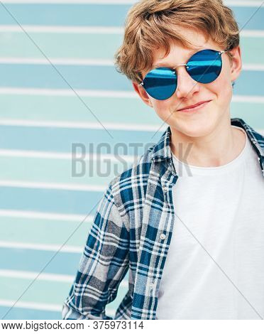 Blonde Hair 12yo Caucasian Teenager Boy Fashion Portrait Dressed White T-shirt With Checkered Shirt 