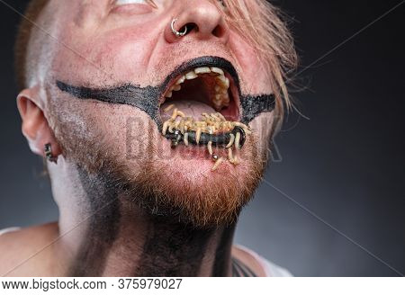 Scary Mad Man With Maggots In His Mouth