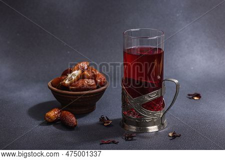 Hibiscus Hot Tea With Dates. Traditional Ramadan Kareem Concept Snack For Iftar Or Suhoor Meal