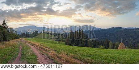 Summer Mountain Green Meadow With Stackes Of Hay (slavske Village, Carpathian Mountains, Ukraine).