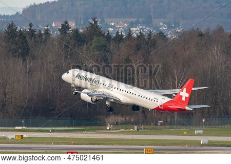 Zurich, Switzerland, January 2, 2023 Helvetic Airways Embraer E195-e2 Aircraft Leaving From Runway 2