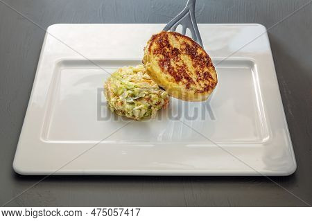 Flat Bread Dumpling Is Placed On Round Shaped Vegetables From Carrots And Pointed Cabbage On A Moder