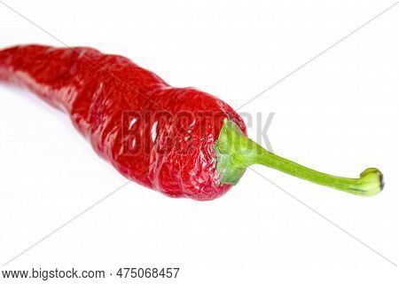 Hot Chili Peppers Are Red On A White Background. Chili Pepper On White. Hot Pepper Whole With A Gree