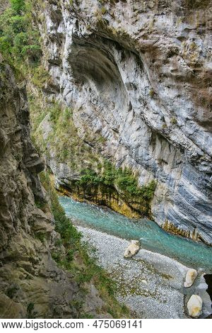 Scenic View Of Swallow Grotto Yanzikou Trail With Narrow Turquoise Liwu River Gorge And High Mountai