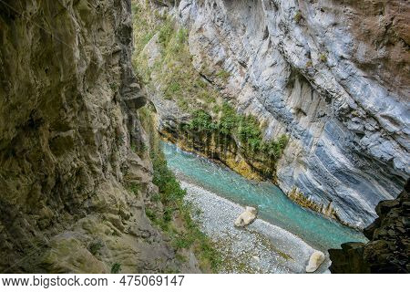 Scenic View Of Swallow Grotto Yanzikou Trail With Narrow Turquoise Liwu River Gorge And High Mountai