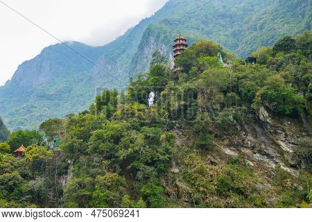 Chinese Pagoda And Buddha Statue At The Top Of Mountain In Taroko National Park Gorge In Hualien, Xi
