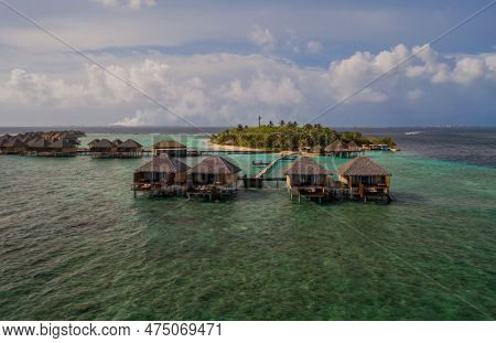 Lonely Island In Indian Ocean. Maldives. Aerial Drone Shot. July 2021.