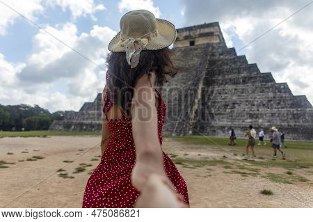Sexy Couple Holding Hands In The Mayan Ruins Of Mexico. Girl Carrying Boyfriend To Mexican Temple Of