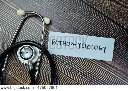 Concept Of Pathophysiology Write On Sticky Notes With Sthethoscope Isolated On Wooden Table.