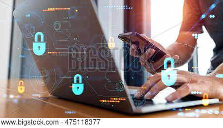Man Hands Typing In Laptop, Using Phone In Hand. Double Exposure Futuristic Cybersecurity Hologram W