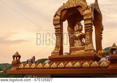 Thailand, Patong - 03.29.23: Altar House Of Golden Color Spirits On The Roof Of A Building In Thaila