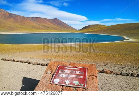 Laguna Miniques Lake With The Information Board, Located In The Altiplano Of Antofagasta Region, Los