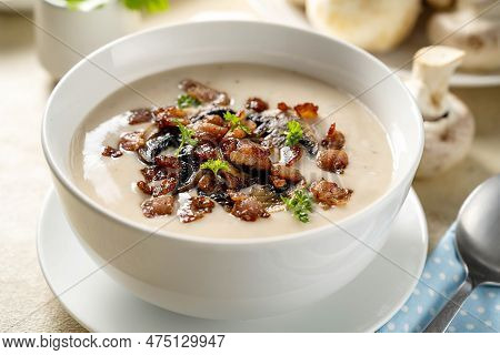 Closeup Mushroom Creamy Soup With Bakon Garnish In A Bowl.
