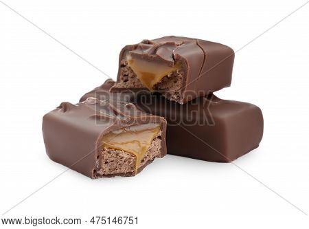 Pieces Of Chocolate Bars With Caramel On White Background