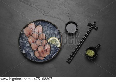 Raw Mackerel Slices, Ice Cubes And Lemon Served With Vasabi And Soy Sauce On Grey Table, Flat Lay. F