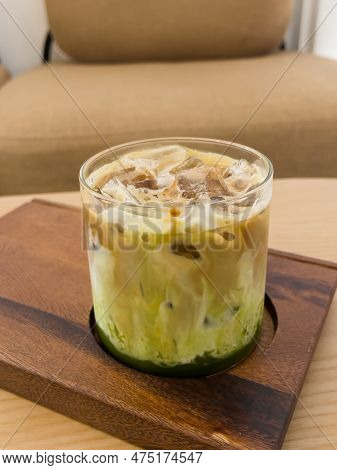 A Glass Of Iced Greentea And Layer Of Coffee, Stock Photo