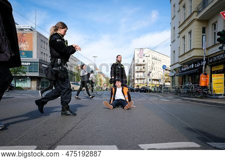 Berlin, Germany - April 24, 2023: Protesters From The Group Last Generation Sitting On The Street An