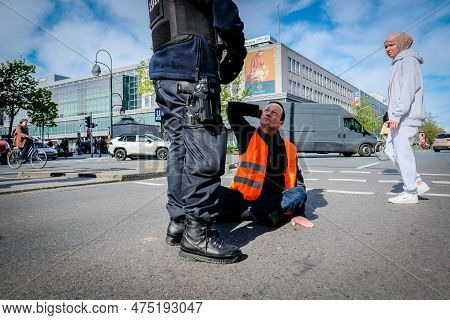 Berlin, Germany - April 24, 2023: Protesters From The Group Last Generation Sitting On The Street An