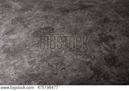 Top View On Black Slate Texture. Illuminated Anthracite Background With Abstract Stone Structure. Mo