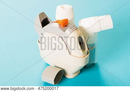 World Asthma Day Concept. Asthma Inhales On The Blue Background For Print.