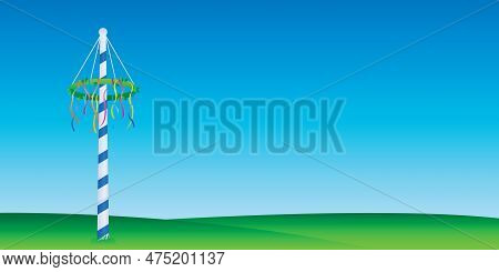 Maypole With Colorful Ribbons On Green Meadow