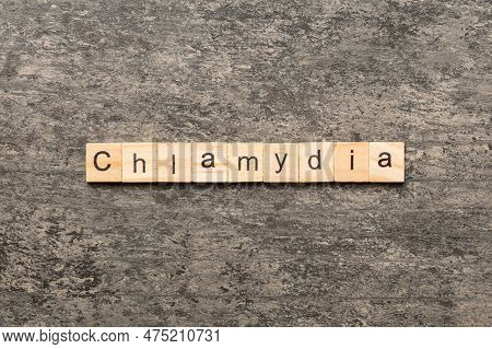 Chlamydia Word Written On Wood Block. Chlamydia Text On Table, Concept.