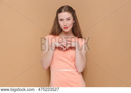 Portrait Of Cunning Sly Attractive Woman With Long Hair Standing With Playful Bitchy Facial Expressi