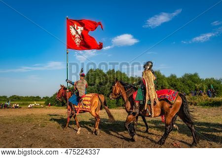 Gniew, Poland, Aug 2020 Polish Hors Cavalry, Hussars, Riding With The Flag, Historical Reenactment O