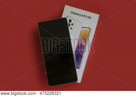 April 22, 2023 Ukraine City Kyiv Smartphone Samsung Galaxy A 73 On A Colored Background