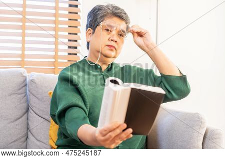 Presbyopia, Hyperopia Mature Asian Woman Holding Eyeglasses Having Problem With Vision Problem Tryin