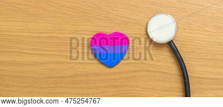 Bisexuality Celebrate Day And Lgbt Pride Month,  Lgbtq+ Or Lgbtqia+ Concept. Stethoscope With Purple