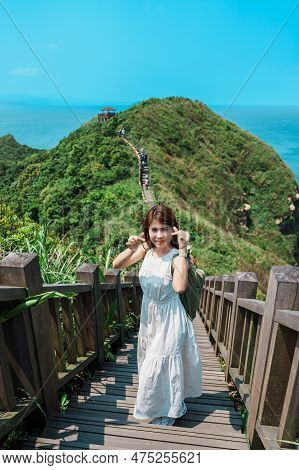 Woman Traveler Visiting In Taiwan, Tourist With Backpack Sightseeing In Bitou Cape Hiking Trail, New