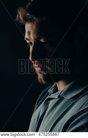 The Young Guy Thought. Portrait On A Dark Background.