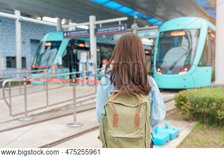 Woman Traveler Visiting In Taiwan, Happy Tourist Traveling In Light Rail System Near Tamsui District
