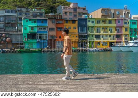 Man Traveler Visiting In Taiwan, Tourist Sightseeing In Keelung, Colorful Zhengbin Fishing Port, Lan