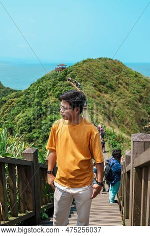 Man Traveler Visiting In Taiwan, Tourist Sightseeing In Bitou Cape Hiking Trail, New Taipei City. La