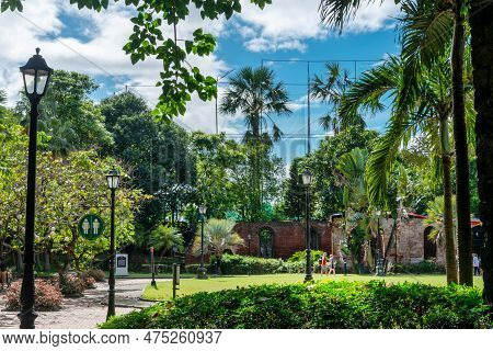 The Lush Gardens At Fort Santiago,with Palm Trees And Retro Street Lamps,intramuros,manila,the Phili