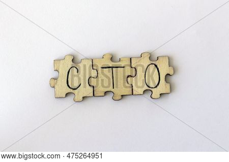 The Acronym Cto, Which Stands For Chief Technology Officer. The Letters Written On The Puzzles.