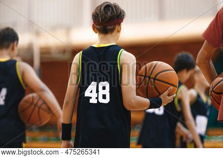 Youth Basketball Team On Training. Basketball Training Session For School Kids. Young Basketball Pla