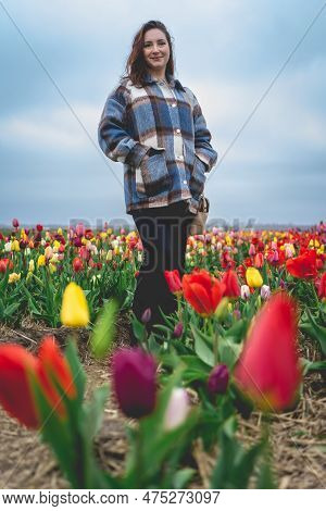 Woman Enjoy The Flower Gardens At The Tulip Barn Hillegom, Netherlands 16 April 2023.