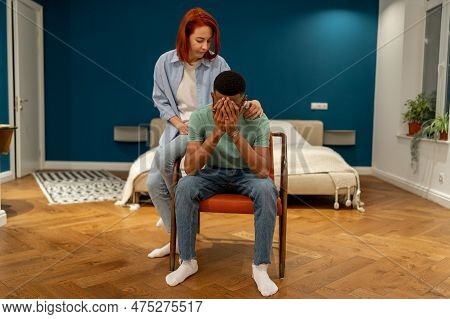 Unhappy Diverse Couple Discussing Divorce At Home, Husband Feeling Sad And Frustrated After Difficul