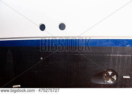 Bow Thruster On The Hull Of The Yacht With Zinc Anodes And Portholes.