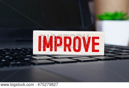 Multiple Arrow Pointing To Colorful Alphabet Word Improve At The Center On Dark Black Cement Wall Ba