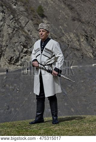 Tliarata. Russia. April 07, 2021. Portrait Of An Elderly Mountaineer In National Dress (white Over A