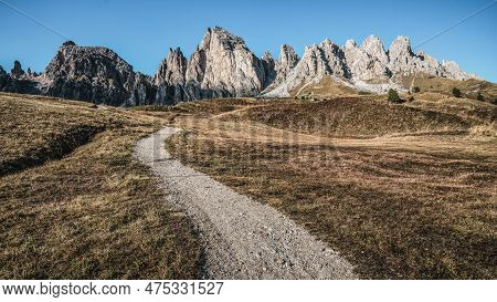Dirt Road And Hiking Trail Track In Dolomites Mountain, Italy, In Front Of Pizes De Cir Ridge Mounta