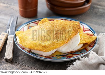 Traditional Venezuelan Beef Cachapa On Wooden Table