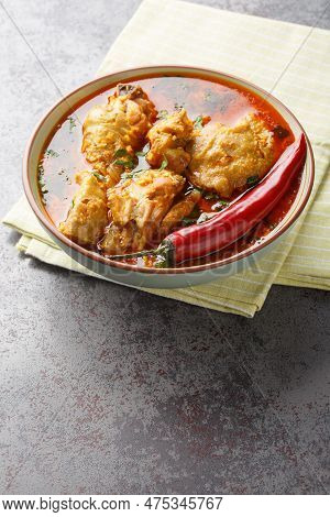 Chicken Cooked In Spicy Gravy Made With Authentic Flavour Of Malvani Closeup On The Bowl On The Tabl