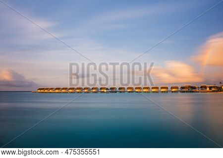 Island In Ocean, Overwater Villas At The Time Sunset With Rainbow. Crossroads Maldives, Saii Lagoon 